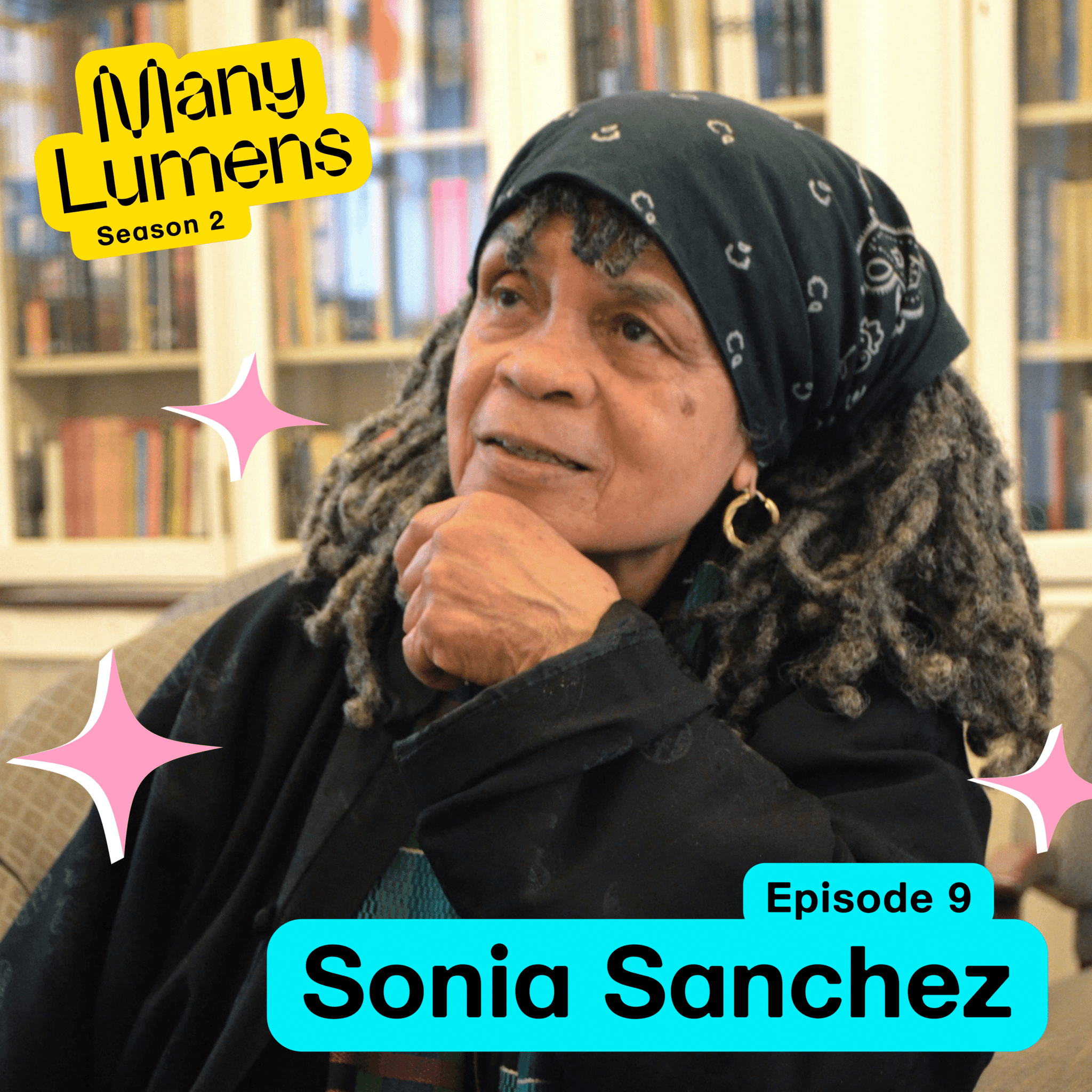 Sonia Sanchez in side profile, wearing a scarf in her hair, looks to be pondering something.
