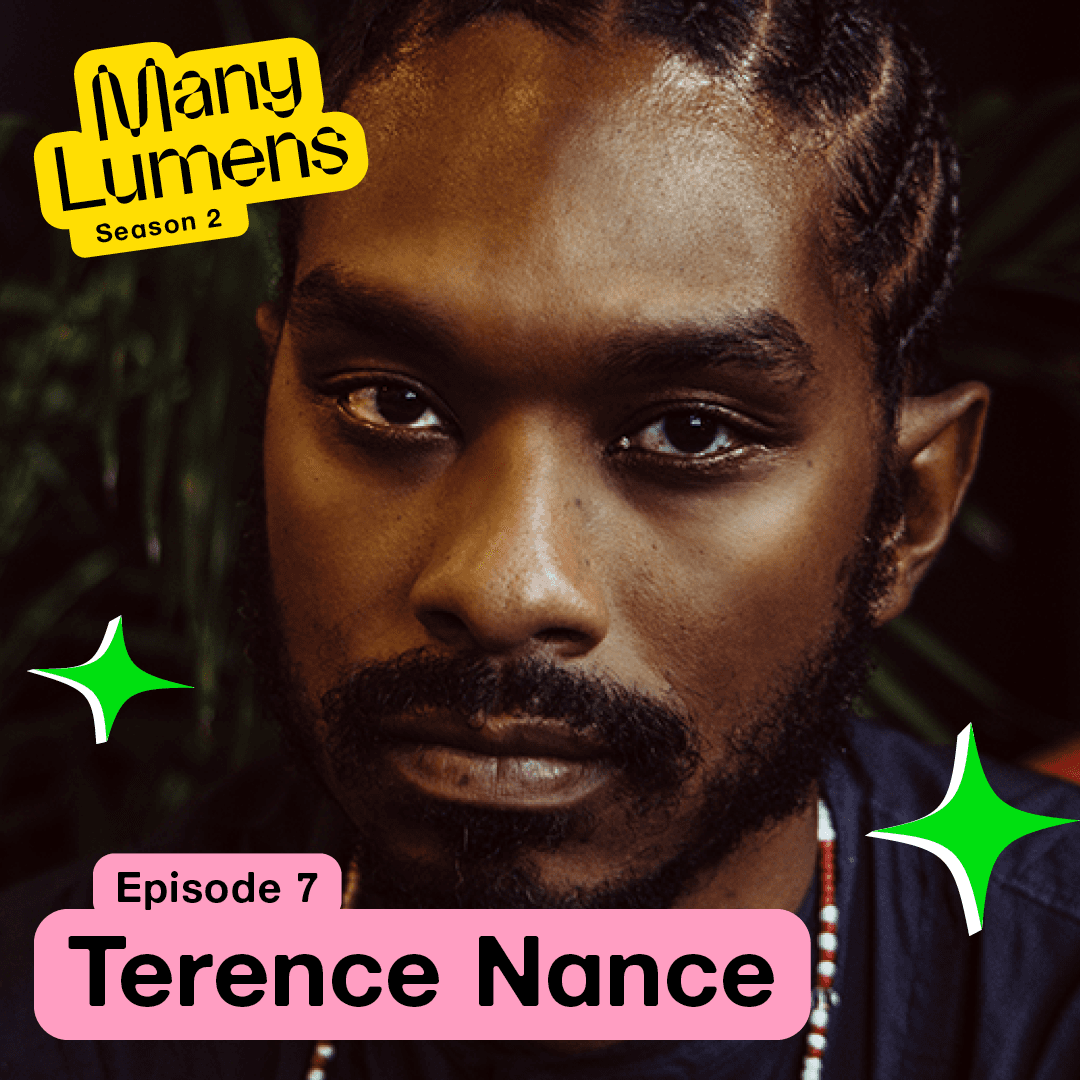 A headshot of Terence Nance. He is looking directly at the camera with a serious expression. His hair is in cornrows and he is wearing a beaded necklace. The Many Lumens logo is on the top left. There are green star icons by his face.