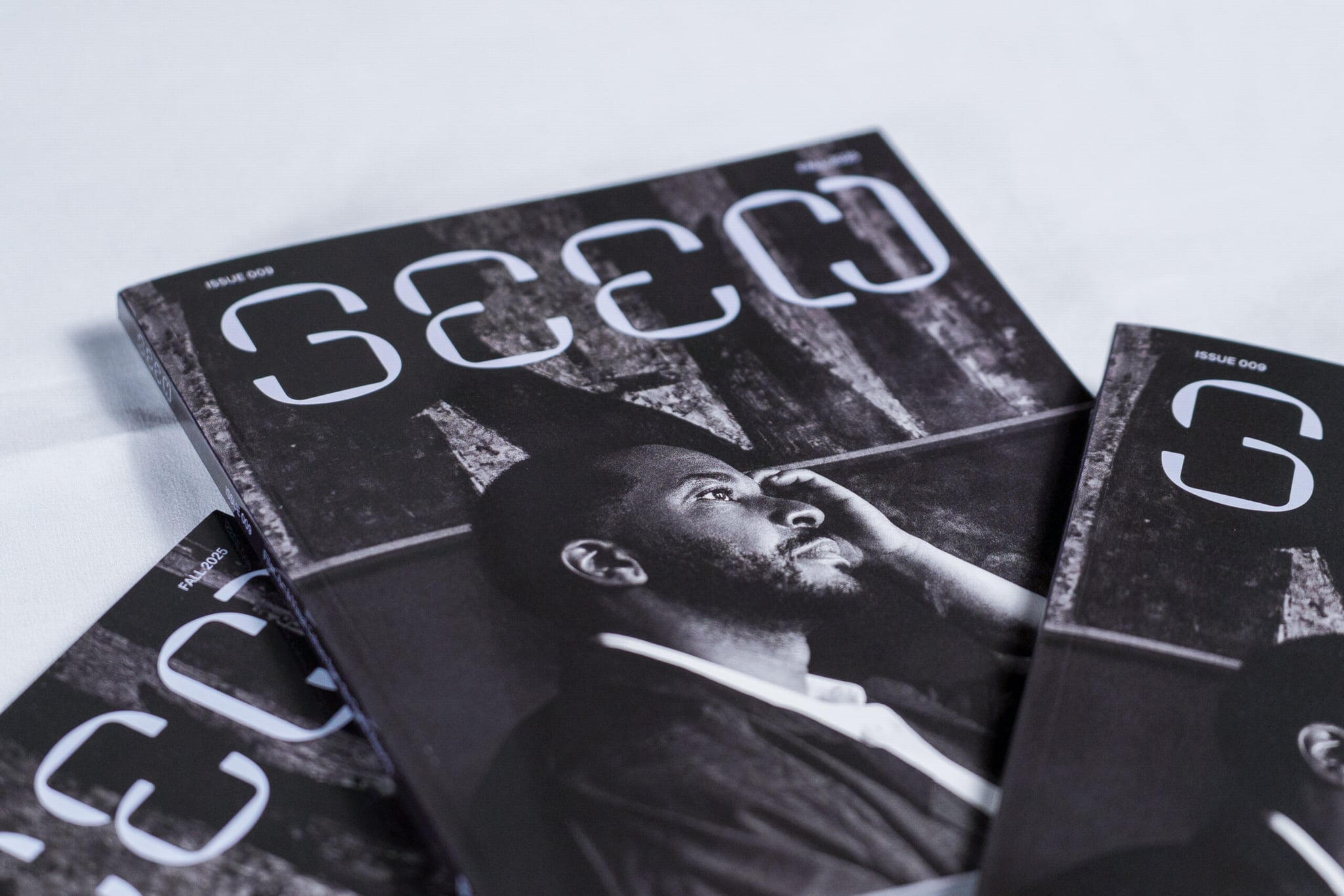 A photo of a several copies of Seen issue 009 laid out on a table.