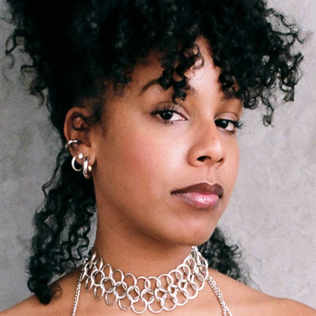 A photograph shows a portrait of Vashni Korin.