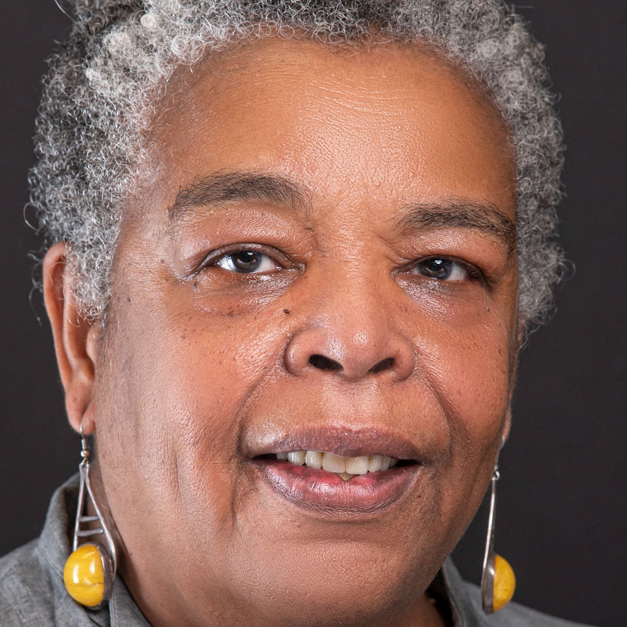 A photograph shows a portrait of Juanita Anderson.