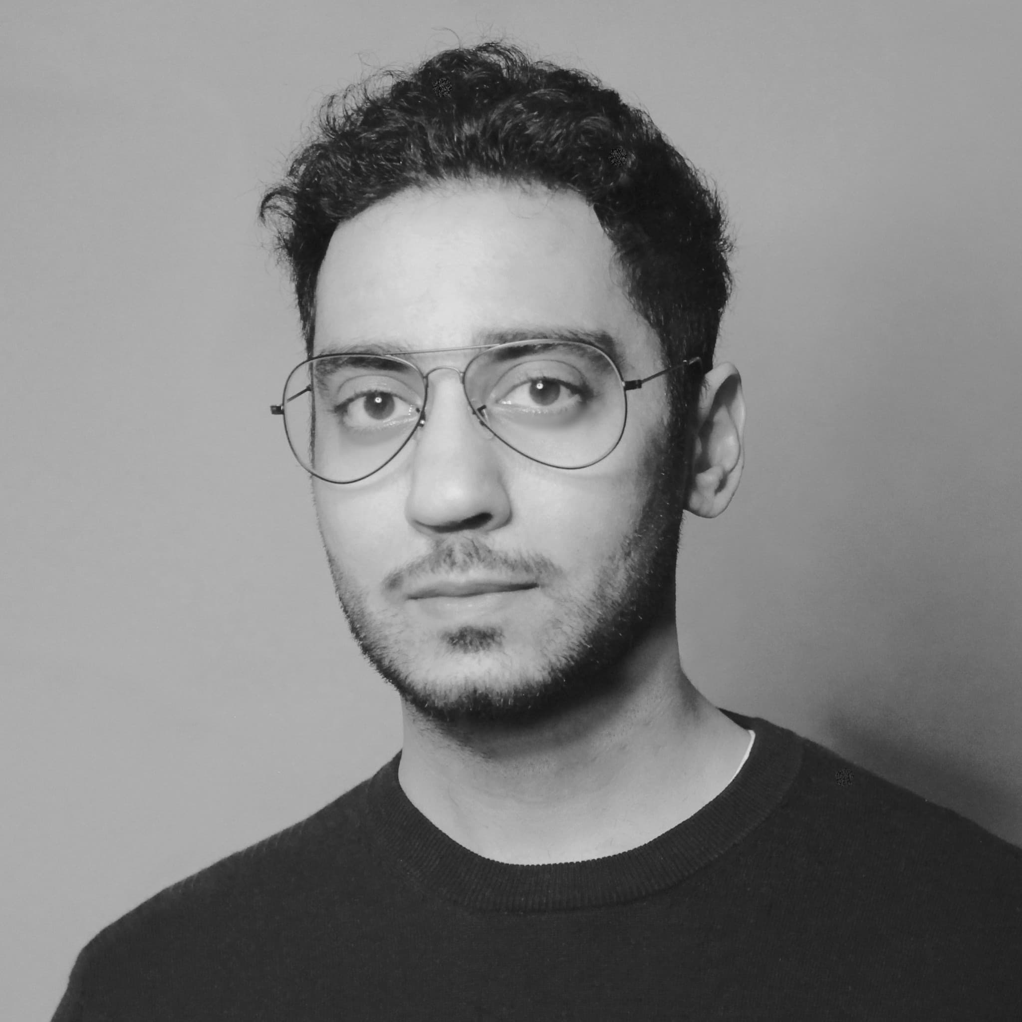 A photograph shows a portrait of Umar Riaz.