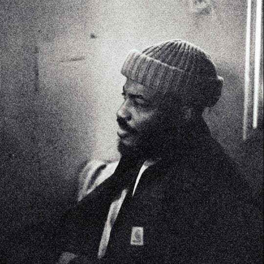 A photograph shows a portrait of Darol Olu Kae.
